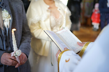 During the wedding ceremony, the priest reads the Gospel.