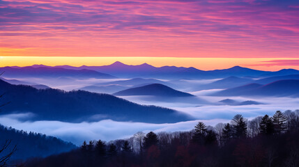 Naklejka na ściany i meble A frosty January sunrise over a mountain range, with hues of pink and orange in the sky