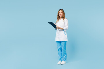 Full body side view fun female doctor woman wear white gown suit work in hospital clinic office...