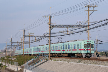 Fototapeta na wymiar 筑紫平野を走る西鉄の電車