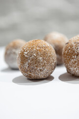 fresh donuts, bread, close-up view, on a light background, blurred background, bakery, baking, donut, sweets, sprinkled with powdered sugar
