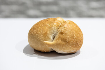 fresh roll, bread, close-up view, on a light background, blurred background, bakery, baking bread, rolls
