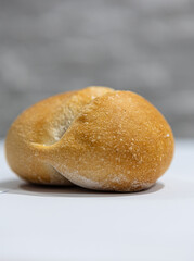 fresh roll, bread, close-up view, on a light background, blurred background, bakery, baking bread, rolls
