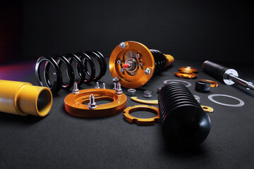 suspension tuning, coilovers, shock absorbers and front springs in yellow and gold colors for a...