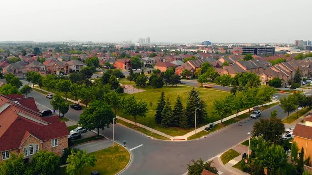 Drone view: Prestigious neighborhood homes, dwellings of good people. Perfect for visuals of upscale, serene home environments, capturing the essence of home in elite areas, suburban life.
