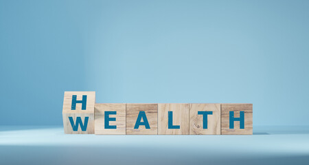 flip wooden cube with word wealth to health for investment in health rather than wealth