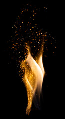 Isolated flames with sparks on a black background