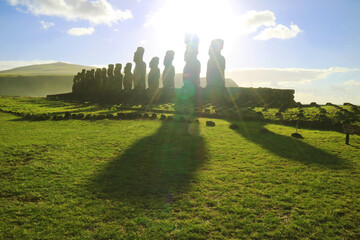 Silhouette of the Iconic 15 Moai statues in morning sunrise at Ahu Tongariki, the largest...