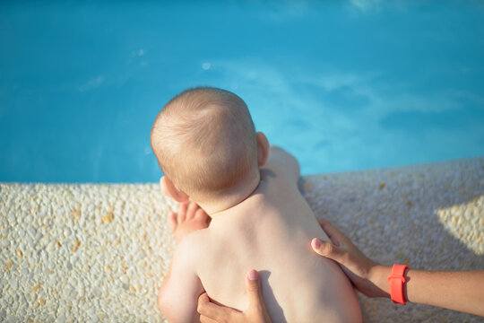 A Small Child Near The Pool Without Adult Supervision, Danger.