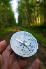 The right compass is always needed for travelers, adequate course. Hiking on coastal coniferous forests of Lake Baikal in Siberia