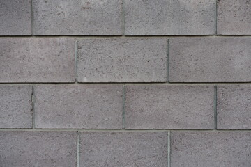 Texture of wall made of gray concrete masonry units