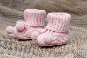 Fototapeta na wymiar baby booties, for newborns, the first shoes for delicate feet