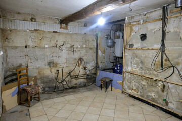 Renovation of an old kitchen from the 70s. In this phase, the old furniture was removed and the old walls exposed.