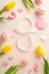 Woman's Day delight: A vertical top view of luxurious tulips, hearts, and ribbon, arrayed to represent a "8" on a pastel beige canvas, perfect for your personal message