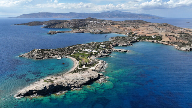 Aerial drone photo of paradise secluded beach and bay of Agios Vasileios located in long peninsula of small island of Schoinousa, Small Cyclades, Greece