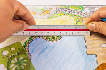 Landscape architect student learning garden plan design by hand drawing.