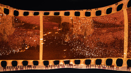 Old Damaged Film Strip Closeup Against A Dark Background