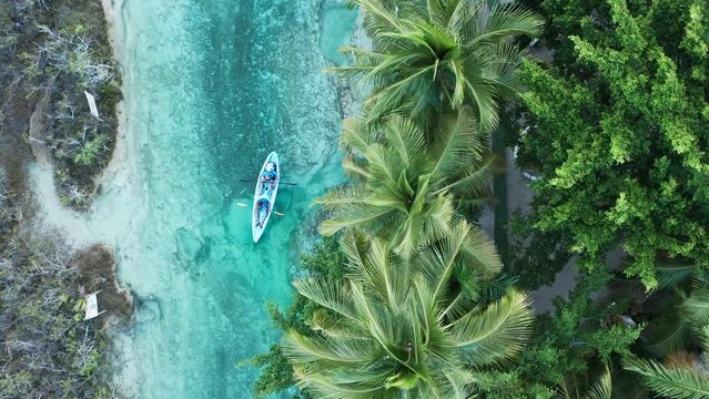 Amazing Landscapes in the caribbean, A canoe is floting on the river