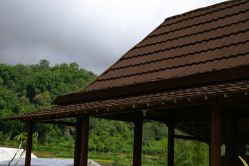 Fototapeta na wymiar traditional building rooftop in the garden