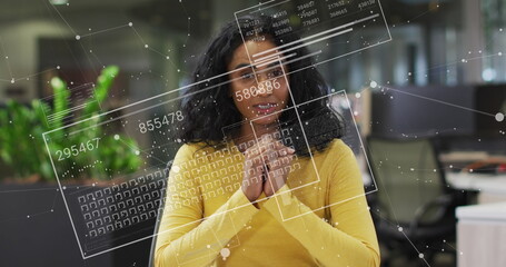 Image of financial data processing over biracial businesswoman