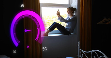Image of purple speedometer over caucasian woman using smartphone at home