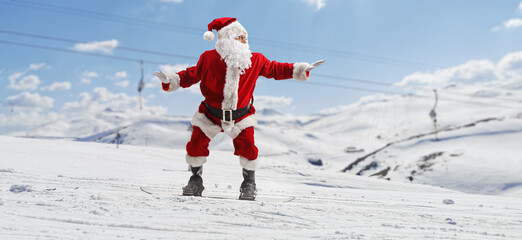 Santa claus at a ski resort on a snowboard