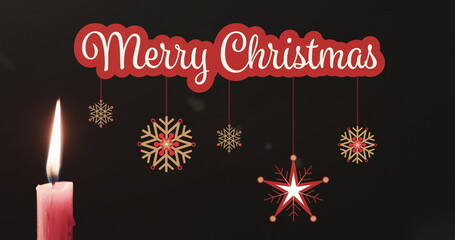 Fototapeta na wymiar Image of merry christmas text over candle and decorations background
