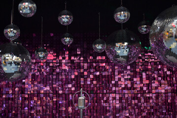 Mirror shiny ball on a pink background. Disco ball