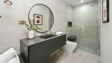 Modern bathroom with a walk-in shower and a black vanity
