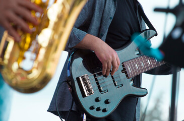 close-up of the hands of a musician playing an electric guitar	
