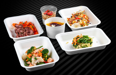 Colorful and nutritious meal kits prepared in eco-friendly containers for a convenient and healthy...