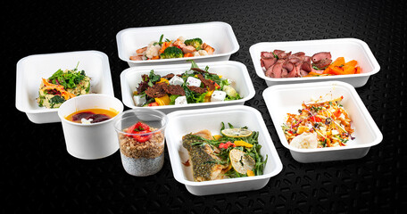 Colorful and nutritious meal kits prepared in eco-friendly containers for a convenient and healthy on-the-go meal.