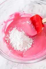 Homemade royal icing for decorating heart-shaped sugar cookies