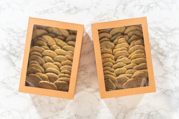 Packing Sprinkle-Adorned Sugar Cookies into Boxes