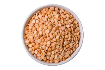 Dried pea grains, divided into halves, are yellow in color when raw