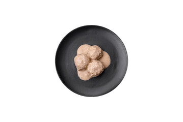 Delicious meatballs from minced chicken or turkey with sour cream sauce
