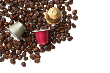 Many coffee capsules and beans on white background, top view. Space for text