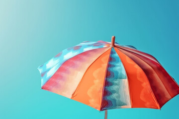 Colorful umbrella on blue background