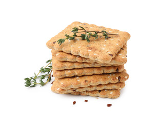 Stack of cereal crackers with flax, sesame seeds and thyme isolated on white