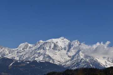 Fototapeta premium snow covered mountains in winter with blue sky view