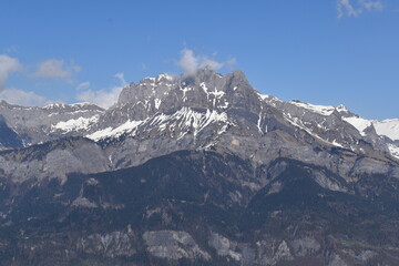 snow covered mountains with stone colors