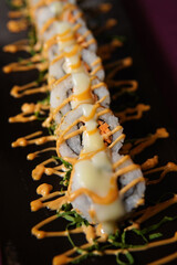 California cheese roll served on a black wooden plate, avocado, cucumber, lump crab meat, sushi menu, social media post, food photography, fine dining, Japanese food, purple background