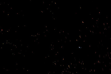 bonfire spark in the dark sky in night, shallow focus