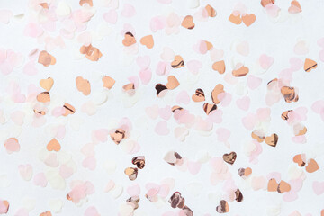 Pink and golden hearts on white table top view, Romantic valentines background