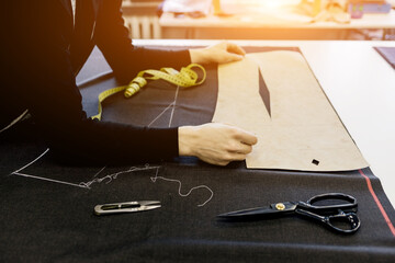  fashion designer working in workshop.