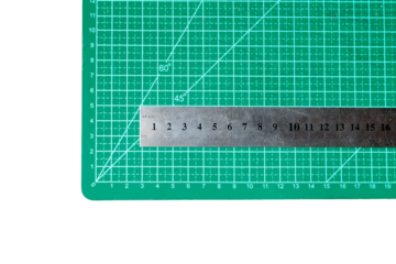 Green cutting mat with a ruler. Cutting concept. do it yourself concept.