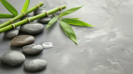 Gray spa background, spa concept, green bamboo and black stones
