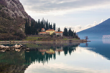 Banja Monastery between Risan and Perast. Morning mist and beautiful calm landscape of Kotor Bay...