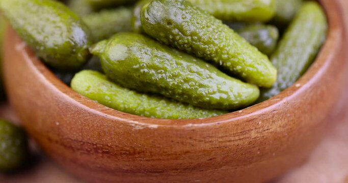 green pickled cucumbers on the table, crispy salted pickled cucumbers of small size
