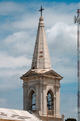 Fototapeta na wymiar A church tower in the countryside